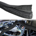 Black braided cable management sleeve shown loose and installed on engine wiring